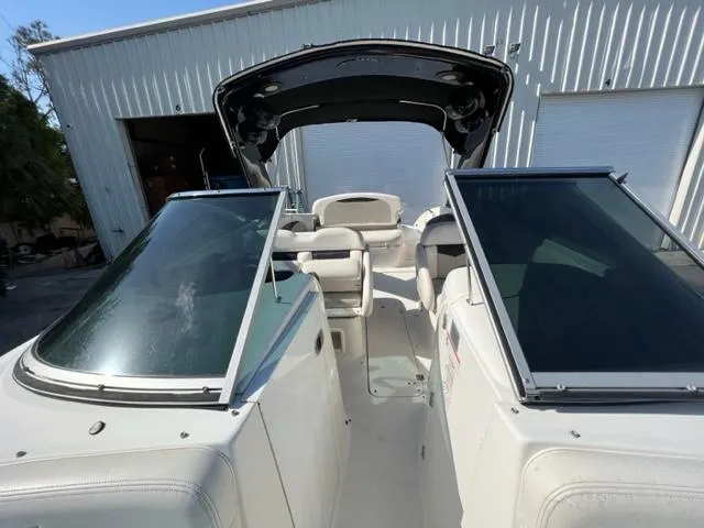 Slide: The Image of 2009 Chaparral 276 SSX boat interior with open windshield and seating. - 13