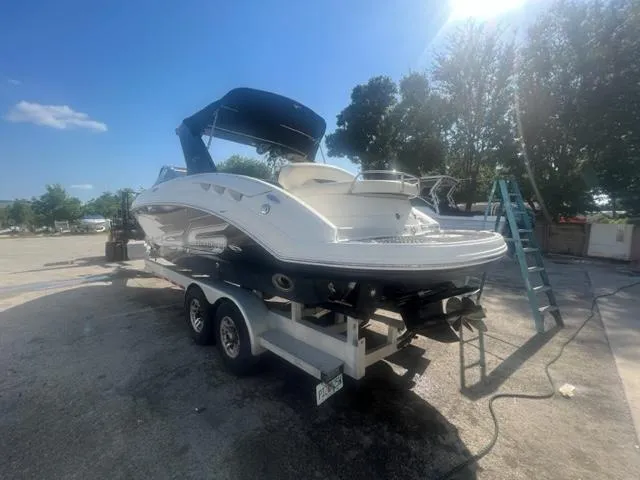 Slide: The Image of 2009 Chaparral 276 SSX boat on a trailer in a sunny outdoor setting. - 3