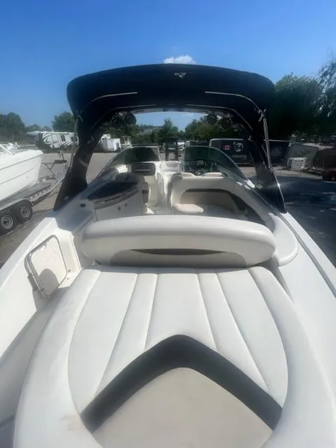 Slide: The Image of 2009 Chaparral 276 SSX boat with white interior and black canopy. - 6