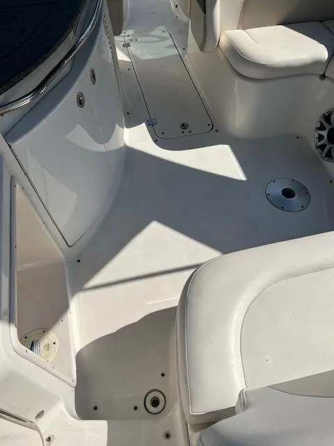 Slide: The Image of 2009 Chaparral 276 SSX boat interior with white seating and deck. - 7