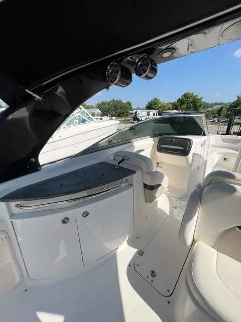 Slide: The Image of 2009 Chaparral 276 SSX boat interior with seating and storage compartments. - 9