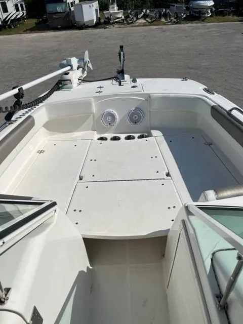 Slide: The Image of 2021 World Cat 230DC boat deck with seating and storage compartments. - 11