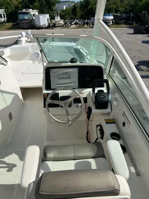 Slide: The Image of 2021 World Cat 230DC boat helm with Garmin navigation system. - 13