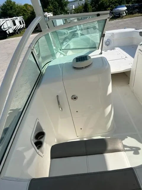 Slide: The Image of 2021 World Cat 230DC boat interior with seating and storage compartment. - 14