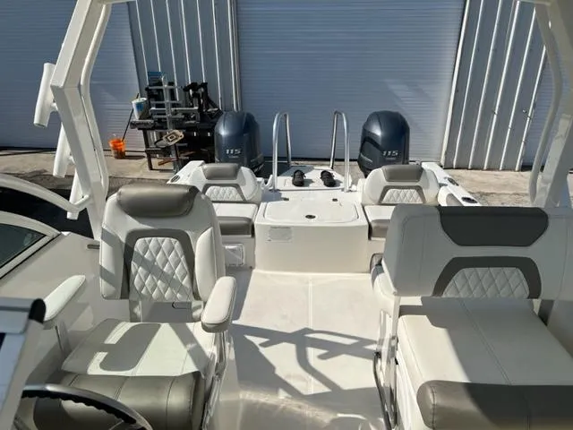 Slide: The Image of 2021 World Cat 230DC boat interior with dual Yamaha 115 engines. - 15