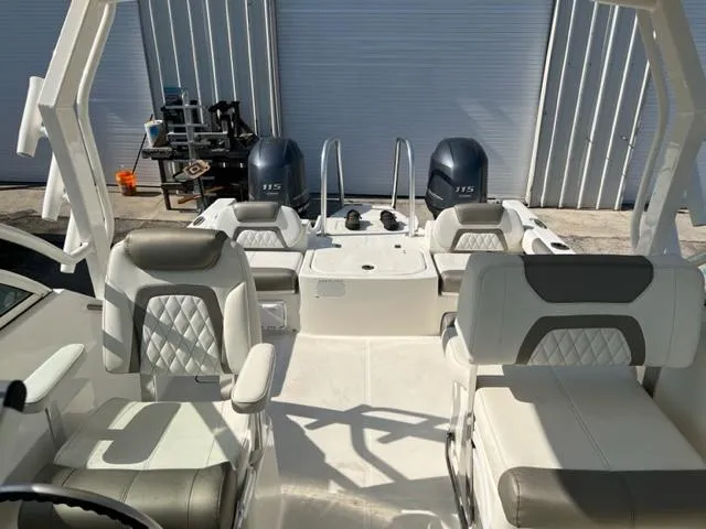 Slide: The Image of 2021 World Cat 230DC boat interior with dual Yamaha 115 engines. - 16