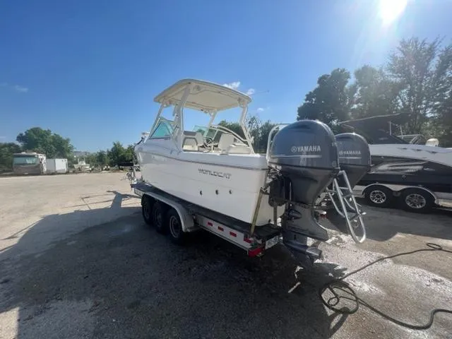 Slide: The Image of 2021 World Cat 230DC boat on trailer with twin Yamaha outboard engines. - 2