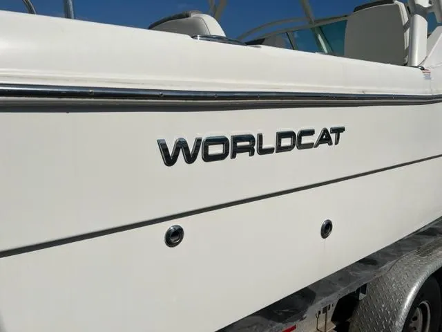 Slide: The Image of 2021 World Cat 230DC boat side view with logo. - 3