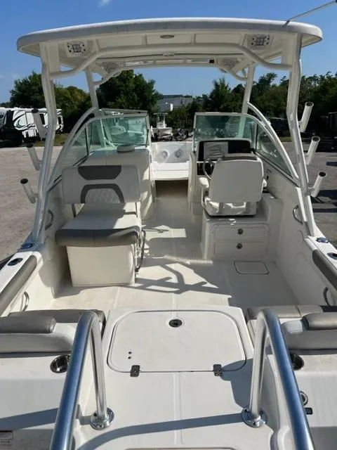 Slide: The Image of 2021 World Cat 230DC dual console boat interior with seating and helm. - 5