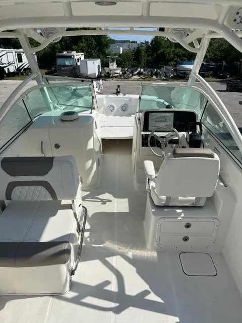 Slide: The Image of 2021 World Cat 230DC boat interior with seating and steering console. - 9