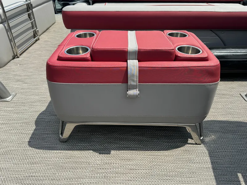 Slide: The Image of 2020 Bennington QSBWAX2SG boat with red and gray cushioned seating and cup holders. - 10