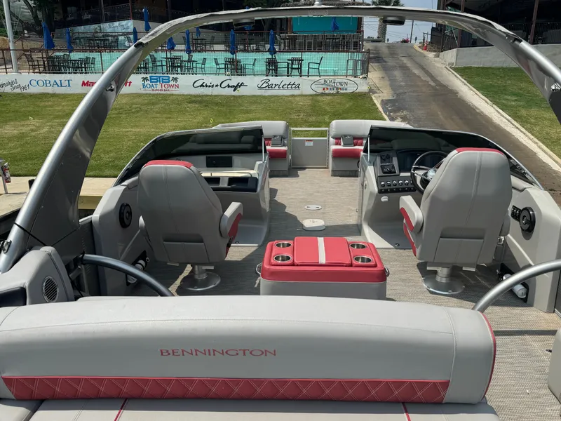 Slide: The Image of 2020 Bennington QSBWAX2SG pontoon boat interior with gray and red seating. - 14