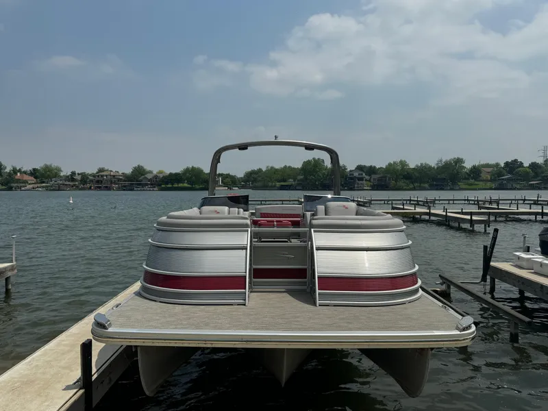 Slide: The Image of 2020 Bennington QSBWAX2SG pontoon boat docked on a lake. - 3