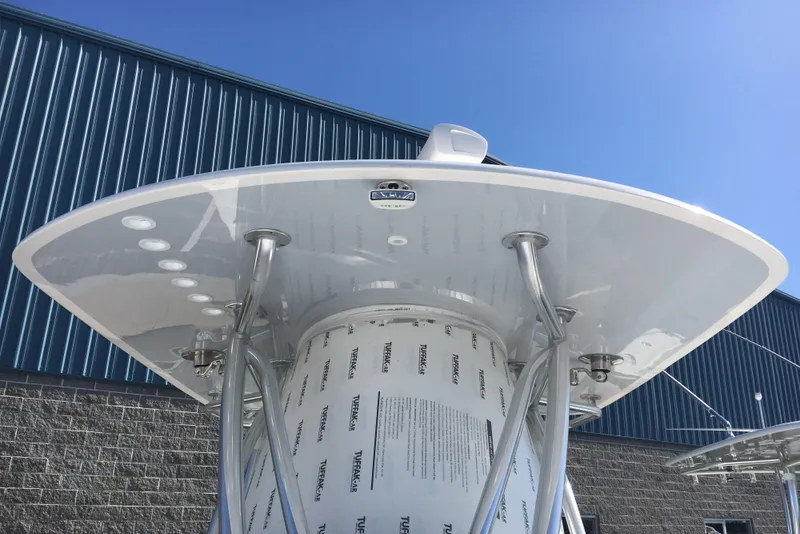 Slide: The Image of 2024 Contender 32 ST boat with T-top against blue sky. - 11