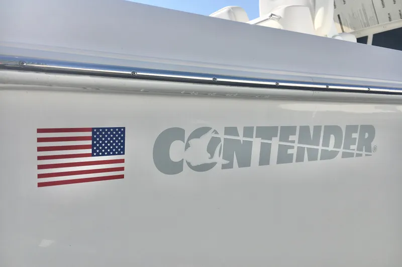 Slide: The Image of 2024 Contender 32 ST boat with American flag decal on the side. - 18
