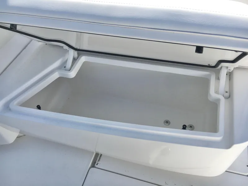 Slide: The Image of 2024 Contender 32 ST boat storage compartment, open and empty, showcasing interior space. - 19