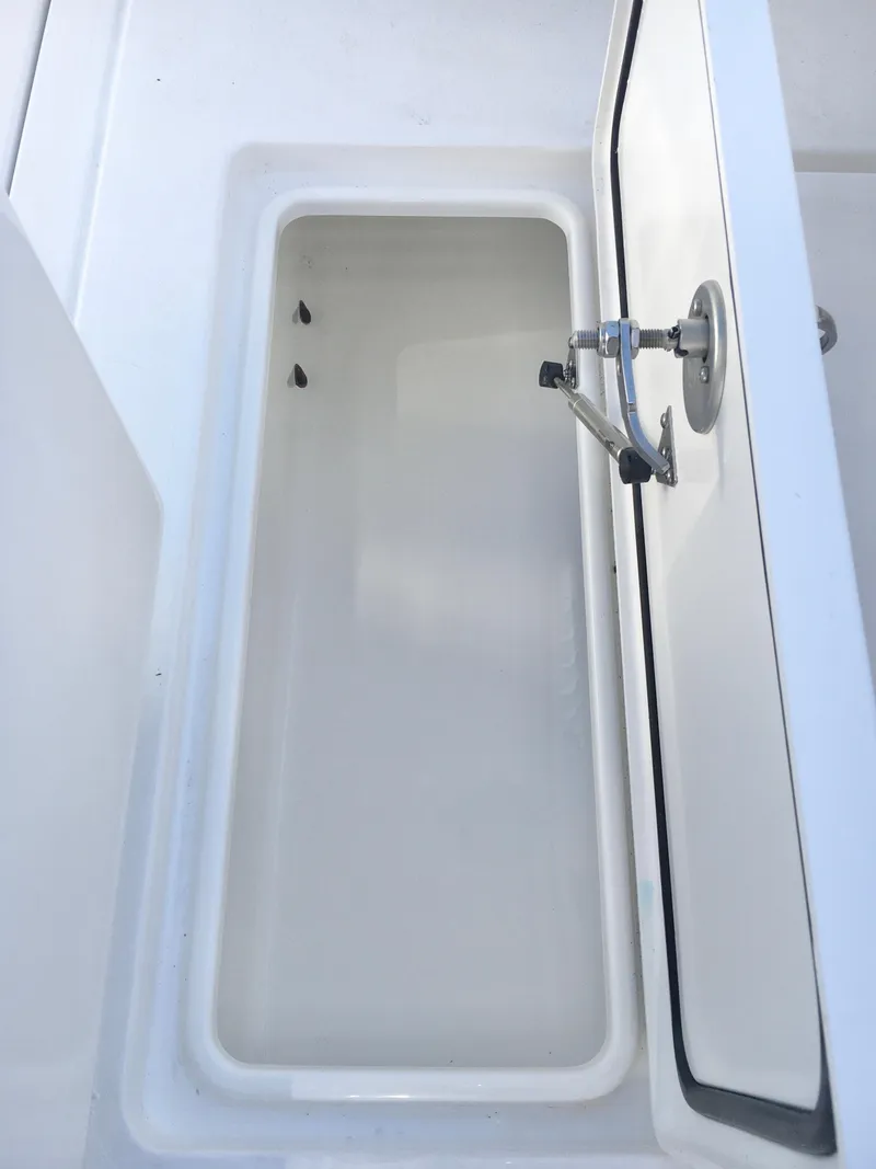 Slide: The Image of 2024 Contender 32 ST boat storage compartment with open lid. - 20