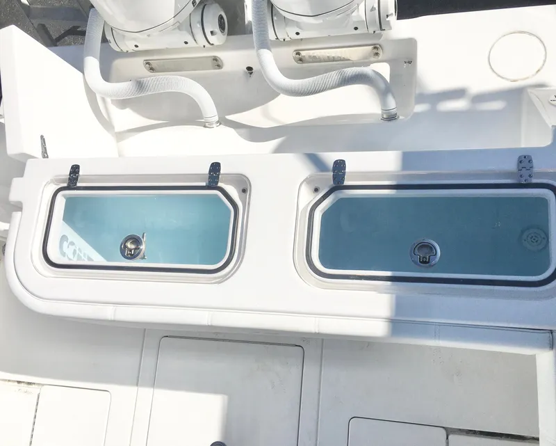 Slide: The Image of 2024 Contender 32 ST boat with dual livewells and white deck. - 25