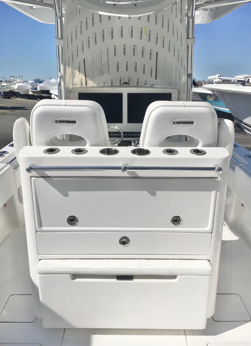 Slide: The Image of 2024 Contender 32 ST boat interior with dual seats and control panel. - 31