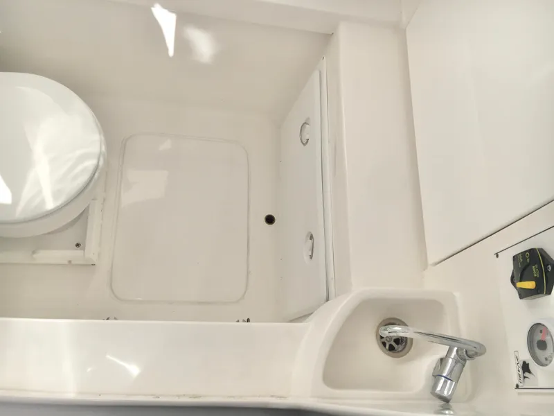 Slide: The Image of 2024 Contender 32 ST boat interior with toilet and sink. - 35