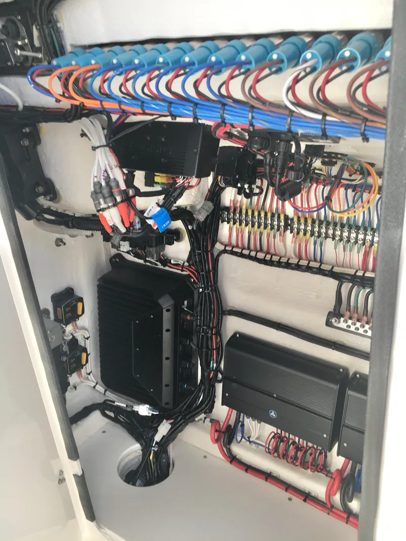 Slide: The Image of 2024 Contender 32 ST electrical wiring system with organized cables and components. - 38