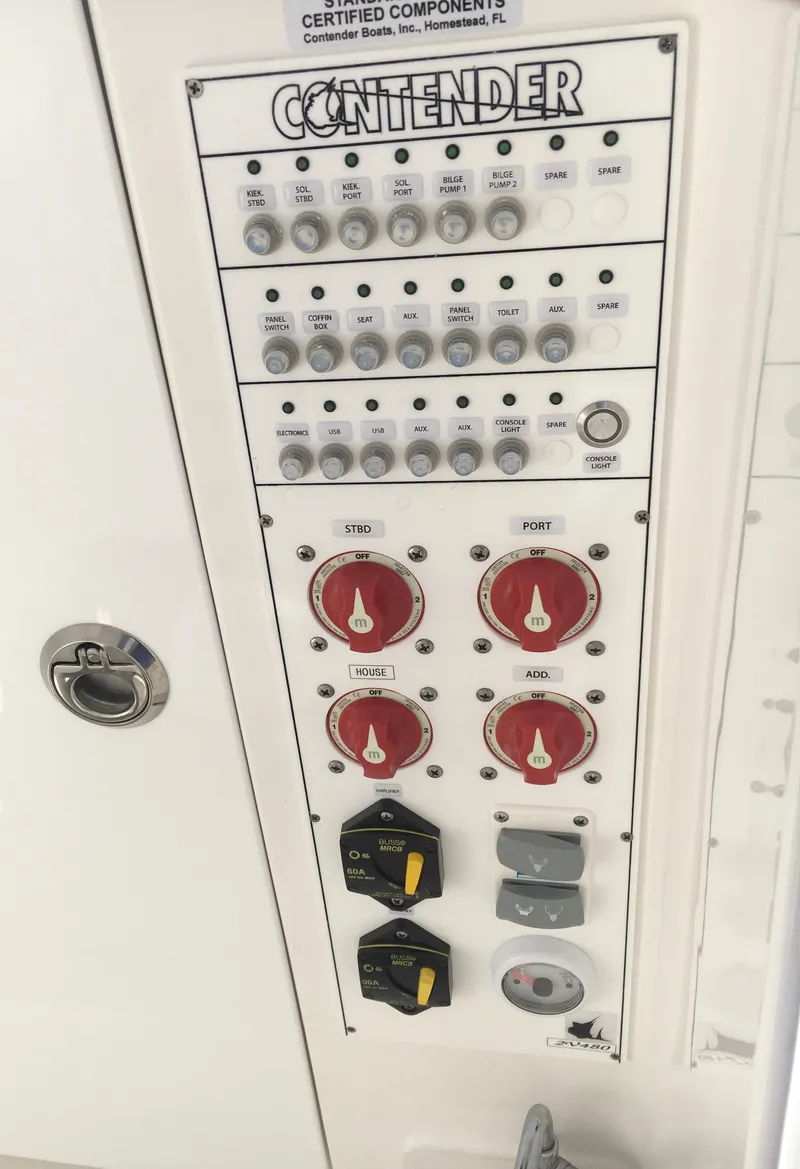 Slide: The Image of Control panel of 2024 Contender 32 ST boat with switches and dials. - 39