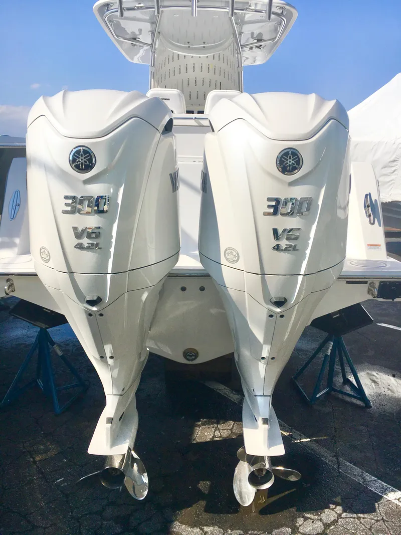 Slide: The Image of 2024 Contender 32 ST with twin 300 V6 outboard engines, rear view. - 7
