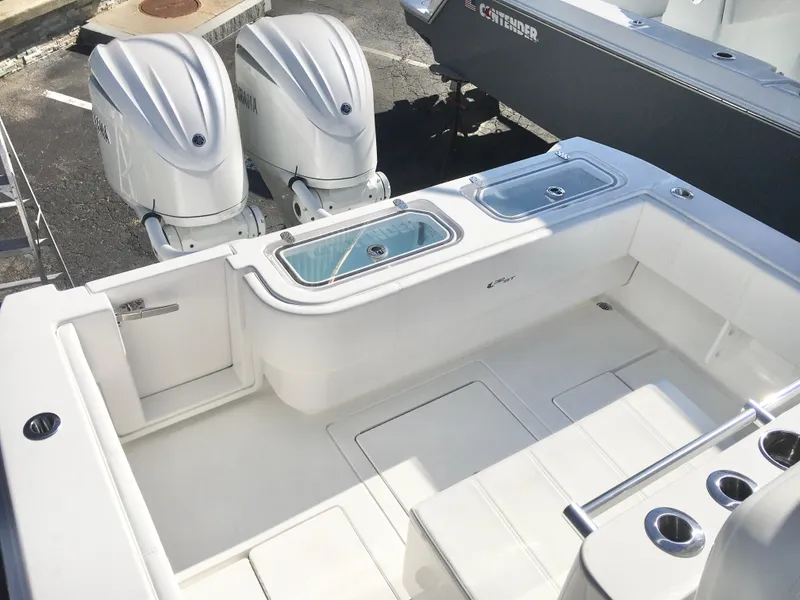 Slide: The Image of 2024 Contender 32 ST boat with dual outboard engines and spacious deck layout. - 8