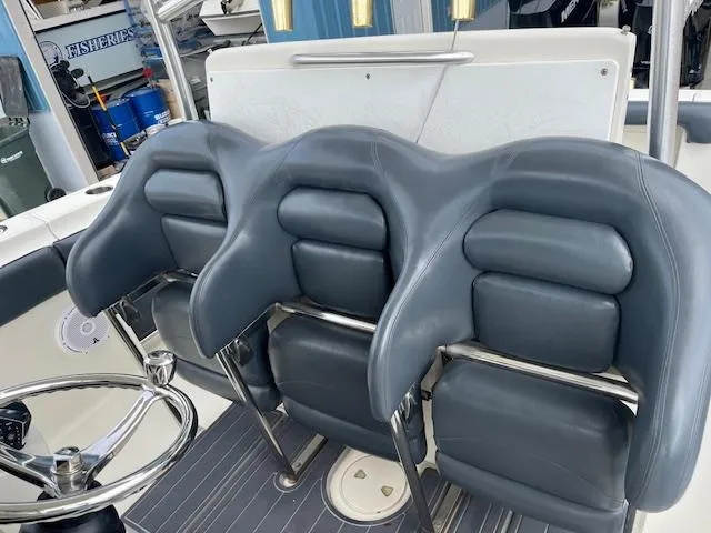 Slide: The Image of 2008 Hydra-Sports 3300 CC boat with three padded seats and steering wheel. - 12