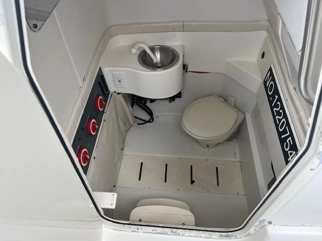 Slide: The Image of 2008 Hydra-Sports 3300 CC boat interior with sink and toilet. - 13