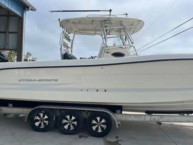 Slide: The Image of 2008 Hydra-Sports 3300 CC boat on trailer, side view, white hull, overcast sky. - 4