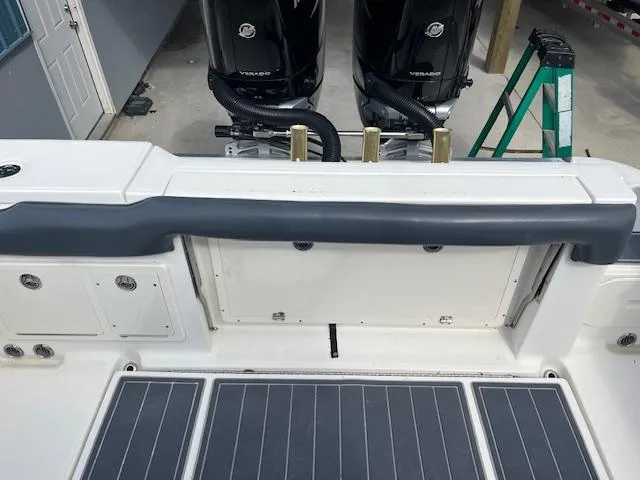 Slide: The Image of 2008 Hydra-Sports 3300 CC boat deck with dual outboard motors in a garage setting. - 6