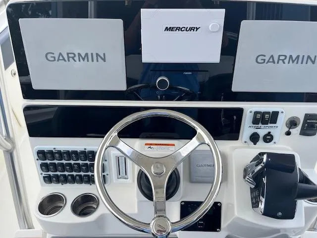 Slide: The Image of 2008 Hydra-Sports 3300 CC boat dashboard with Garmin and Mercury controls. - 7