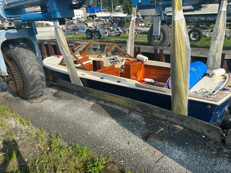 Slide: The Image of 1972 Bertram 25 boat on trailer, outdoor storage, sunny day. - 11