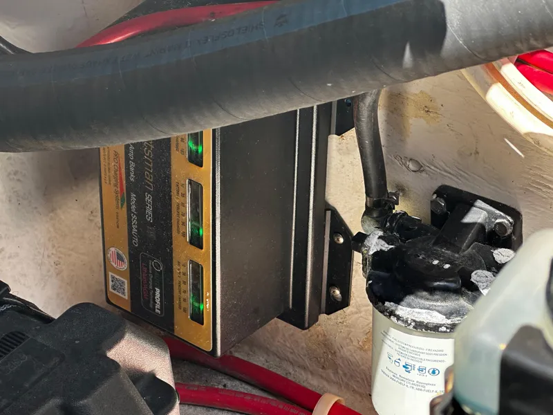 Slide: The Image of Battery charger and filter system in a 2000 Bayliner 3258 Ciera Command Bridge DX. - 13