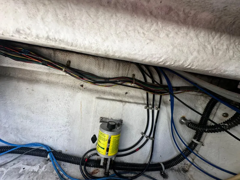 Slide: The Image of Bayliner 3258 Ciera Command Bridge DX 2000 engine compartment wiring and fuel filter. - 14