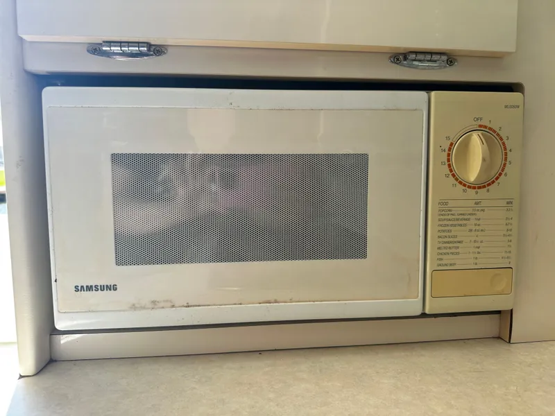 Slide: The Image of Samsung microwave in the kitchen of a 2000 Bayliner 3258 Ciera Command Bridge DX. - 20