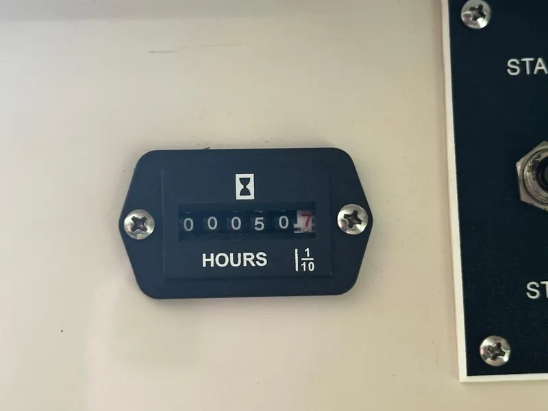 Slide: The Image of 2000 Bayliner 3258 Ciera Command Bridge DX hour meter showing 50.7 hours - 23