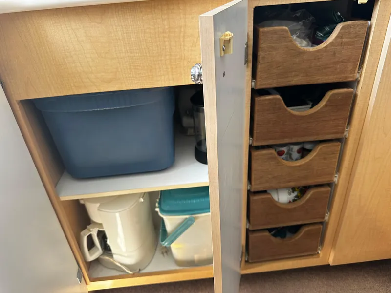 Slide: The Image of Cabinet storage in 2000 Bayliner 3258 Ciera Command Bridge DX boat. - 25