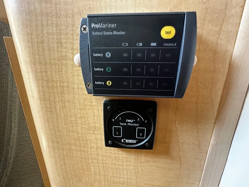Slide: The Image of ProMariner battery status monitor and SCAD tank monitor on 2000 Bayliner 3258 Ciera Command Bridge DX. - 26