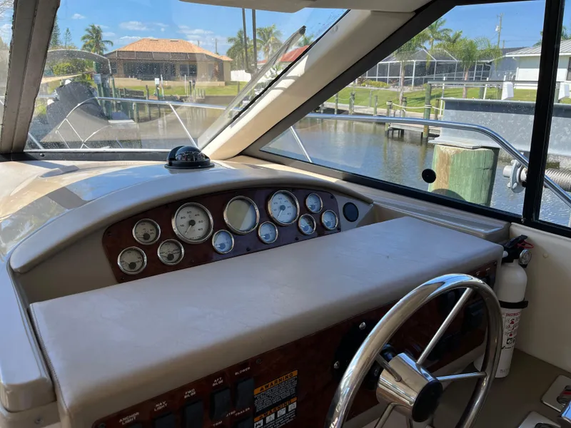 Slide: The Image of 2000 Bayliner 3258 Ciera Command Bridge DX helm with gauges and steering wheel. - 30