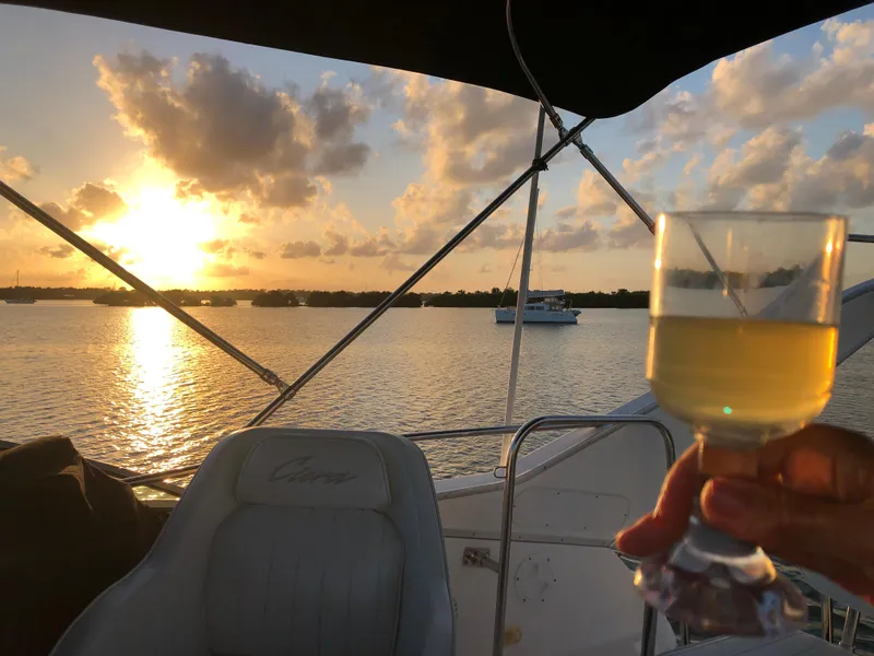 Slide: The Image of Sunset view from a 2000 Bayliner 3258 Ciera Command Bridge DX with a drink in hand. - 38
