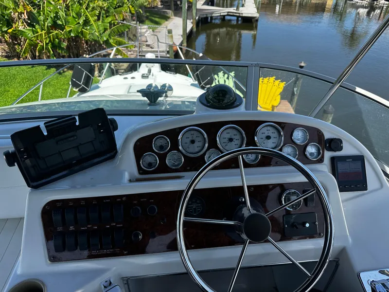 Slide: The Image of Bayliner 3258 Ciera Command Bridge DX 2000 helm with gauges and steering wheel. - 41