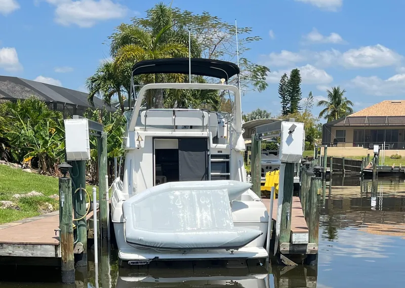 Slide: The Image of 2000 Bayliner 3258 Ciera Command Bridge DX docked at a marina. - 7