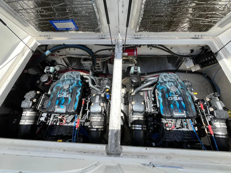 Slide: The Image of Twin engines of a 2000 Bayliner 3258 Ciera Command Bridge DX boat. - 9