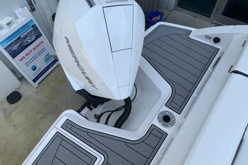Slide: The Image of 2024 Monterey M-225 boat with Mercury outboard engine, rear deck view. - 11