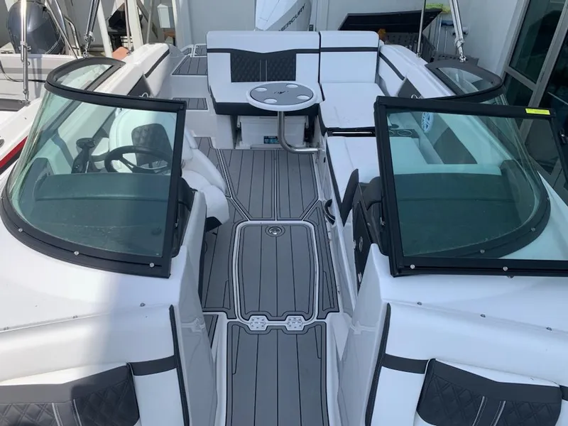 Slide: The Image of 2024 Monterey M-225 boat interior with seating and steering console. - 9