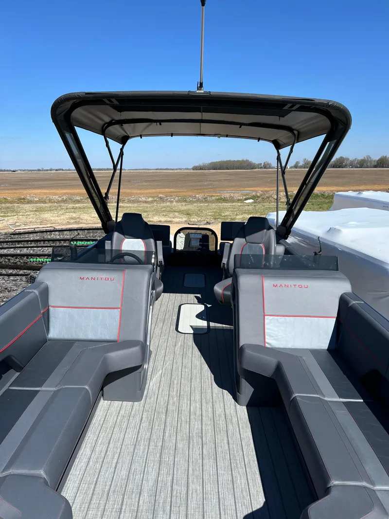 Slide: The Image of 2024 Manitou EXPLORE 24 MAX NAVIGATOR VTOON pontoon boat with spacious seating. - 3
