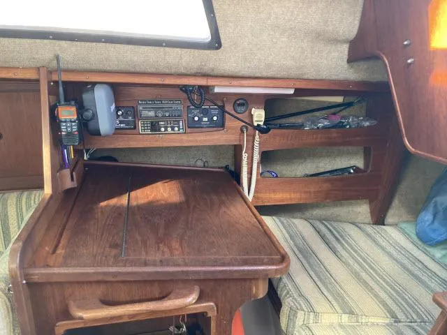 Slide: The Image of Interior of a 1980 Sceptre 36 sailboat with navigation equipment and wooden table. - 10