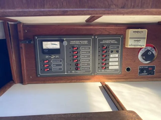 Slide: The Image of Control panel of a 1980 Sceptre 36 boat with switches and gauges. - 13
